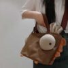 Túi xách gà mắt lồi 16 39 11