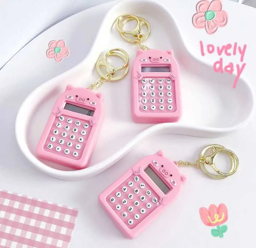 Móc khóa máy tính heo hồng