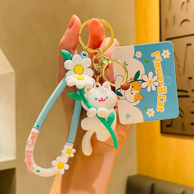 Móc khóa thỏ ôm hoa