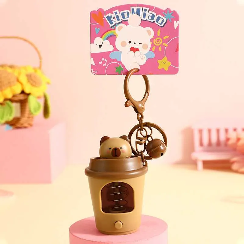 Móc khóa ly cabi bật lên